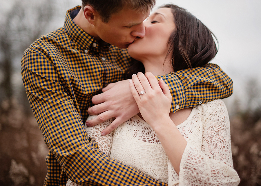Engagement photo ring wrap kiss