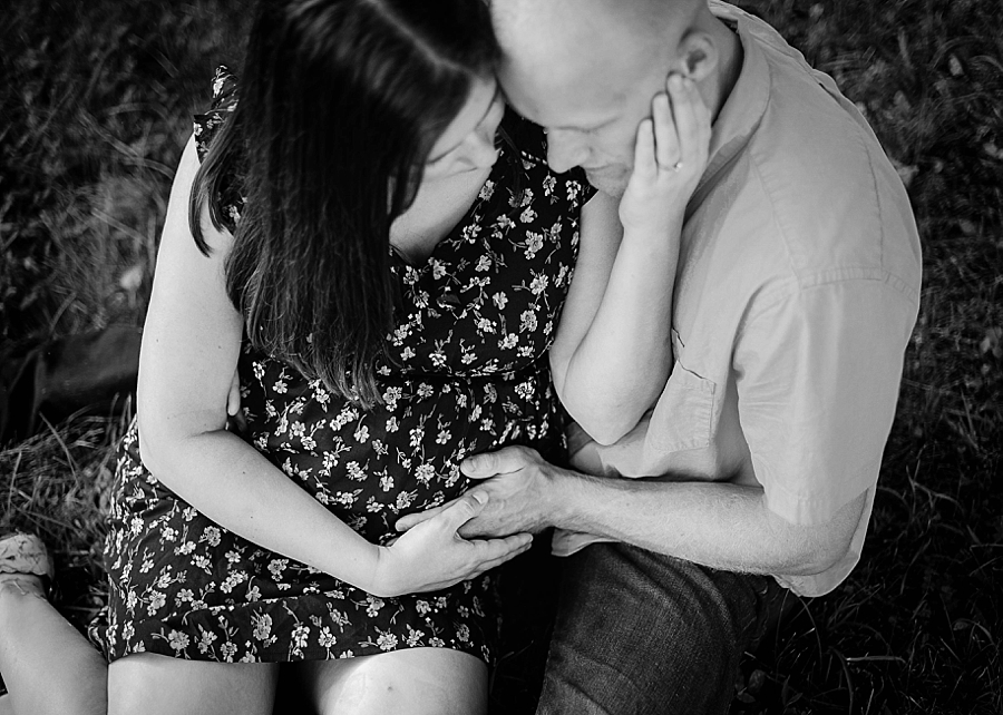 Maternity couple hands on belly overhead view 