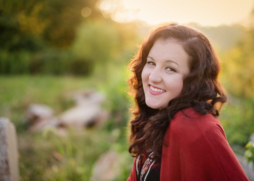 Senior Session in the Mid Ohio Valley - smiling at camera with back light 