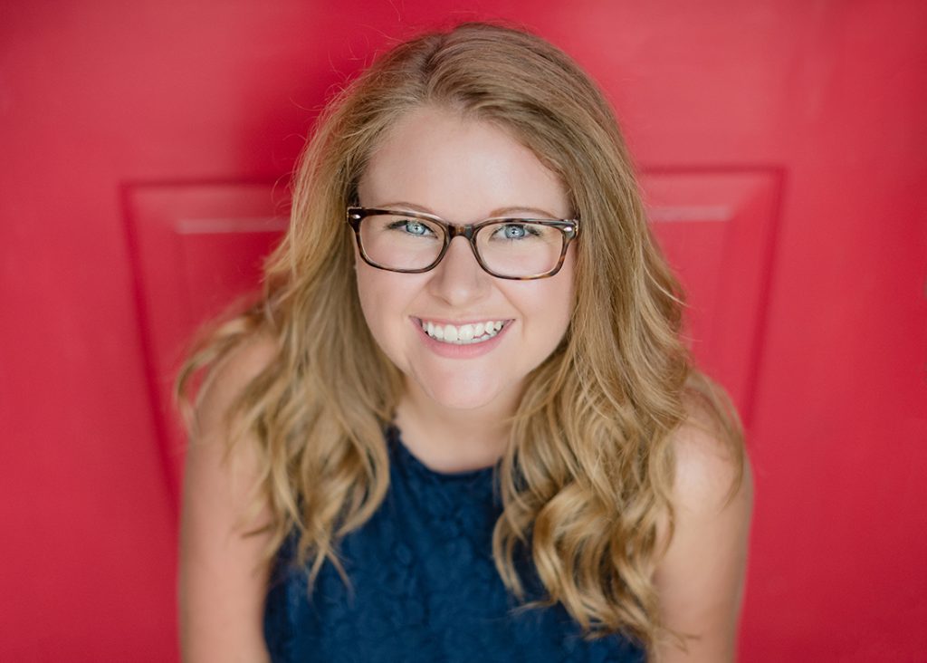 Parkersburg South High School Senior Session - Brianna {Parkersburg, West Virginia} girl with glasses looking at the camera smiling in front of red door 