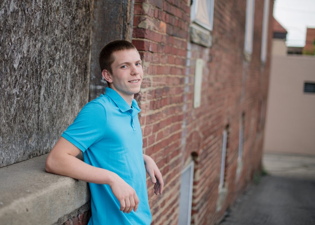 Senior Session | Bobby | guy in front of a brick wall