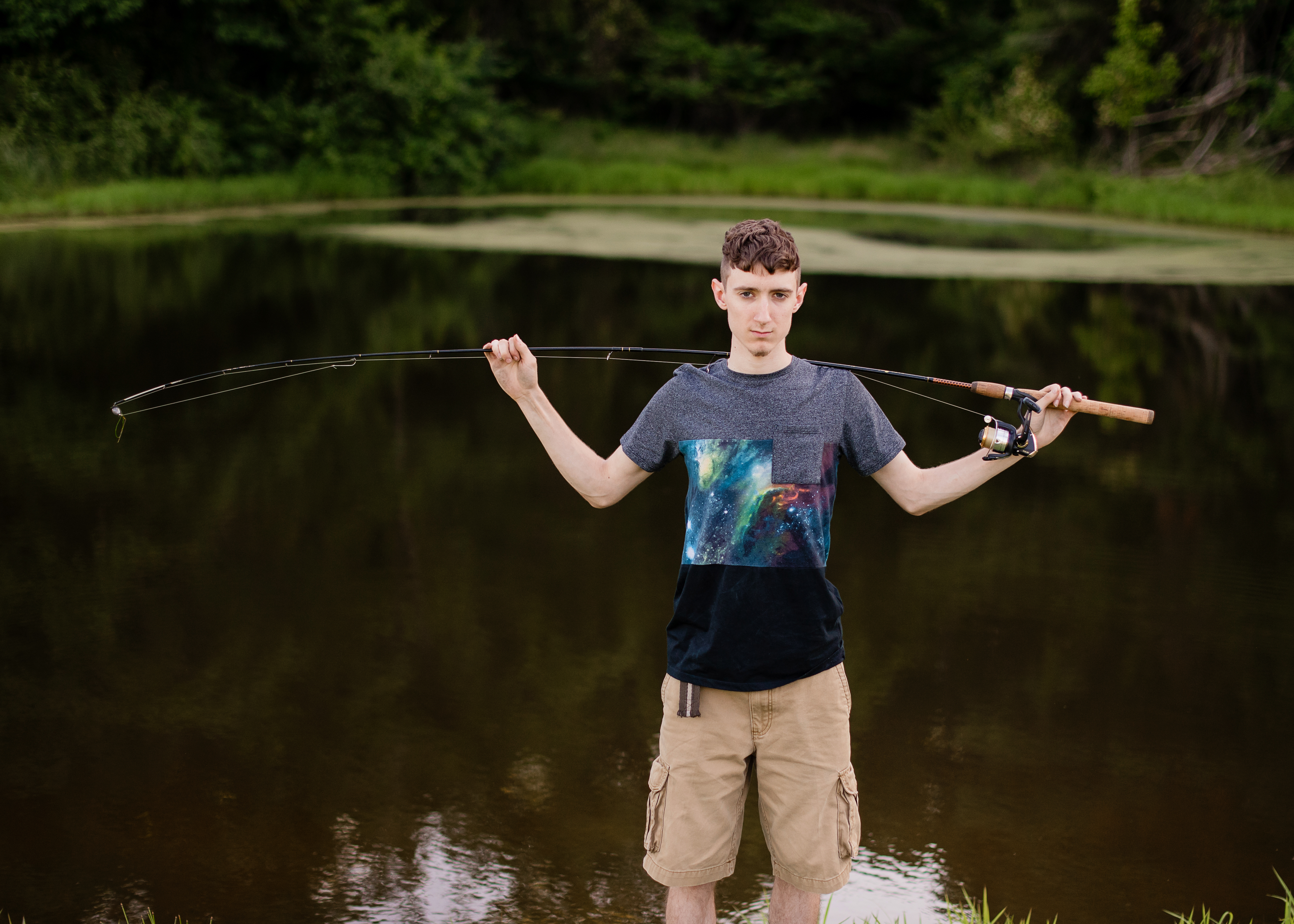 Senior Session | Austin | Belpre, OH standing with fishing pole