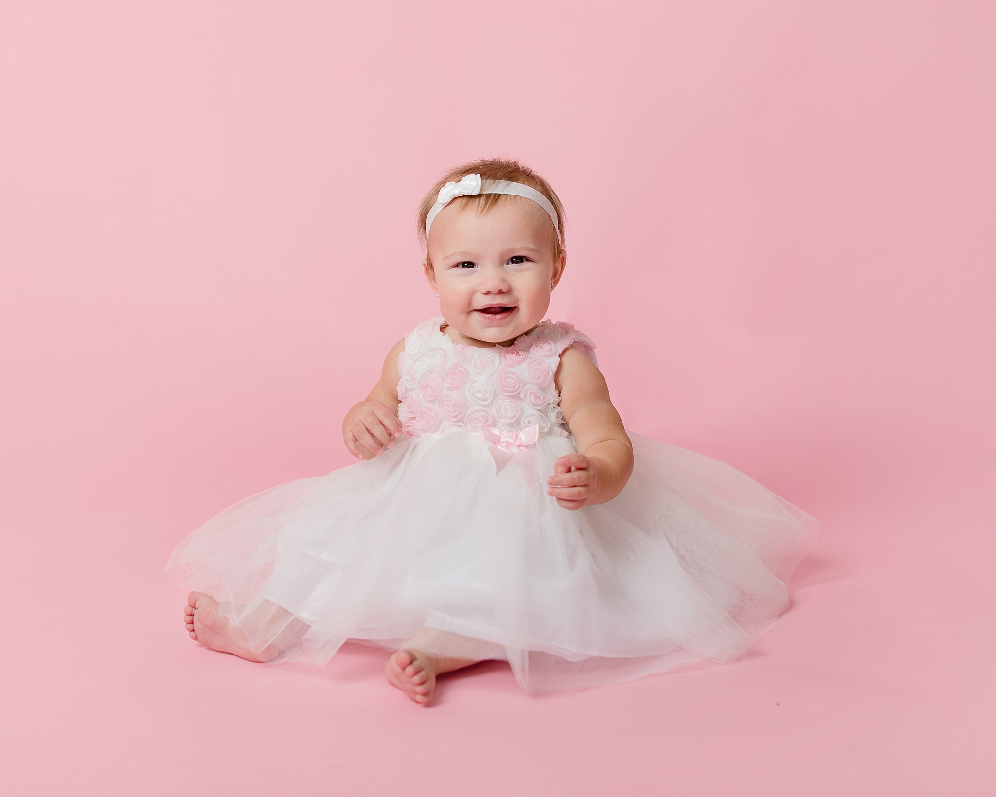 Baby Girl dress on pink background