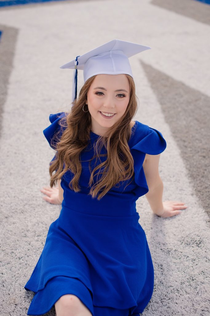 Cap and Gown Senior Session.  Girl with white cap and blue dress