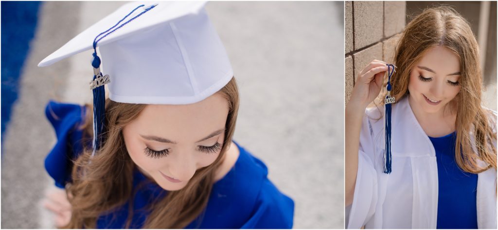 cap and gown photo session with girl showing off her graduation year, 2022, on her tassel.