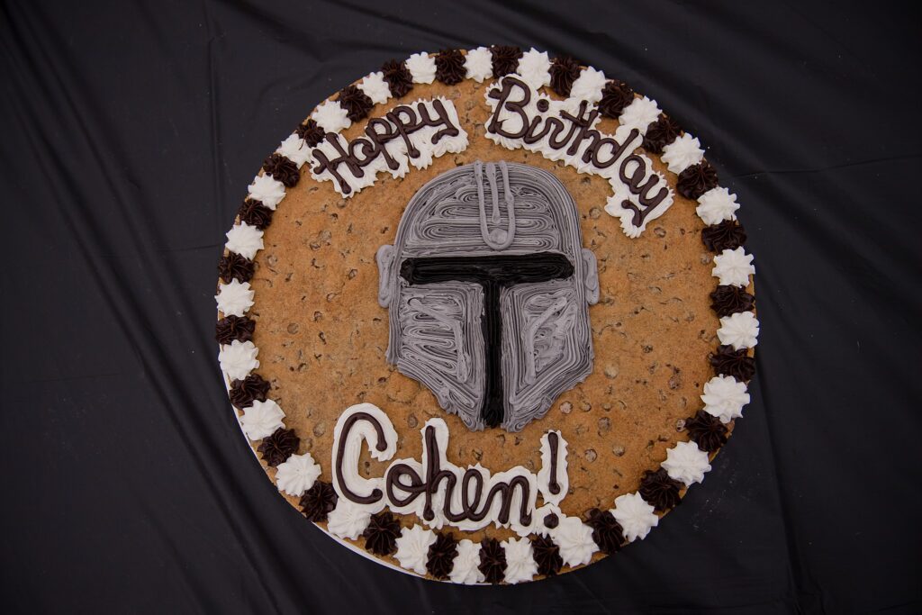 chocolate chip cookie came from american cookie with mandalorian helmet icing design