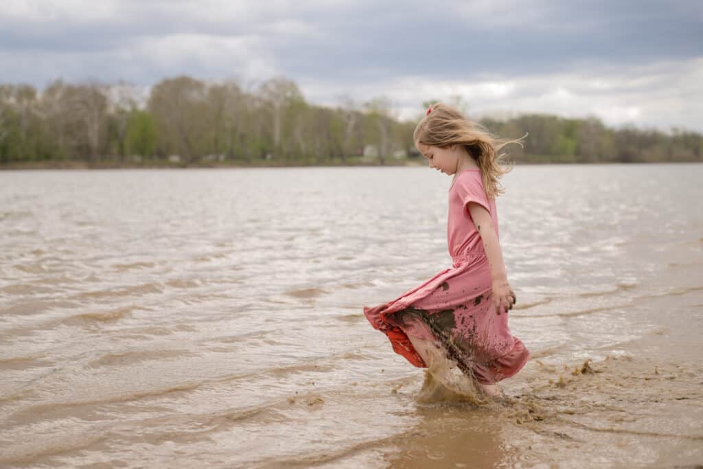 girl playing in riverbanks near mid ohio valley area