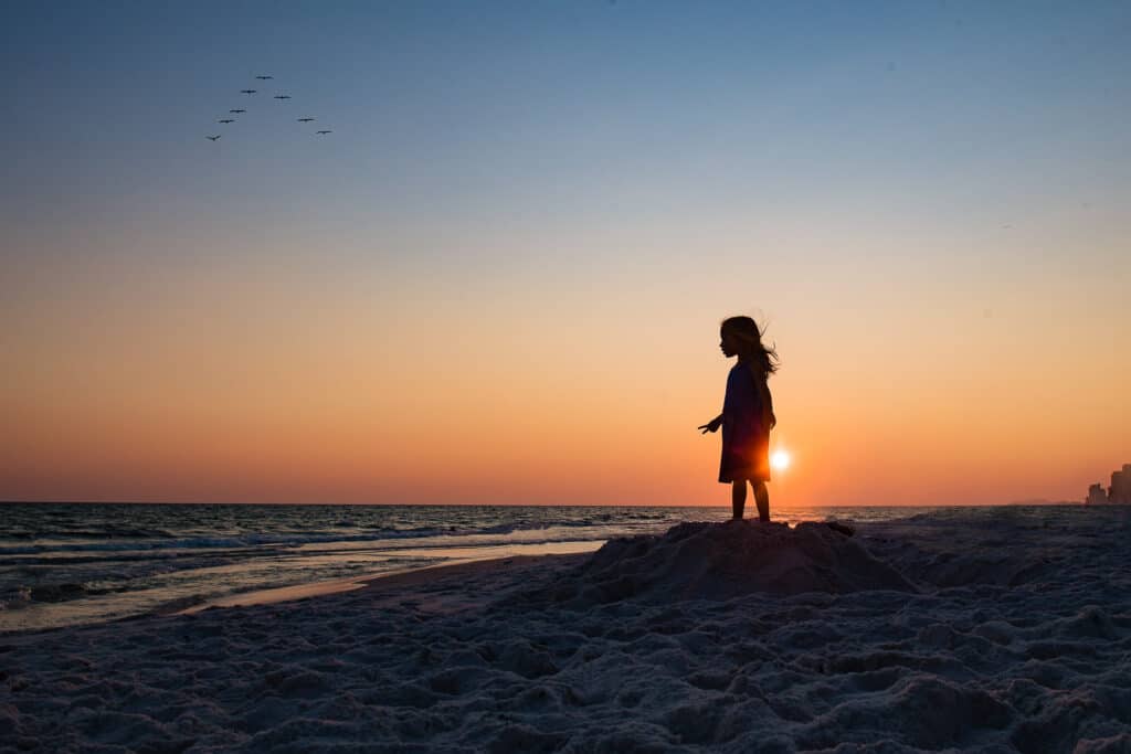 silhouette of girl on beach