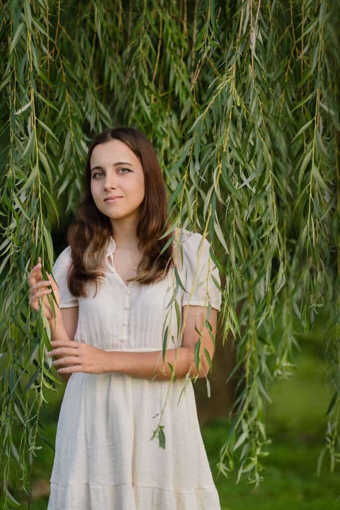 Girl standing in the willows for her Senior Photography Session at Fresh Pickens Farm in Parkersburg WV.  Photography Lori Pickens