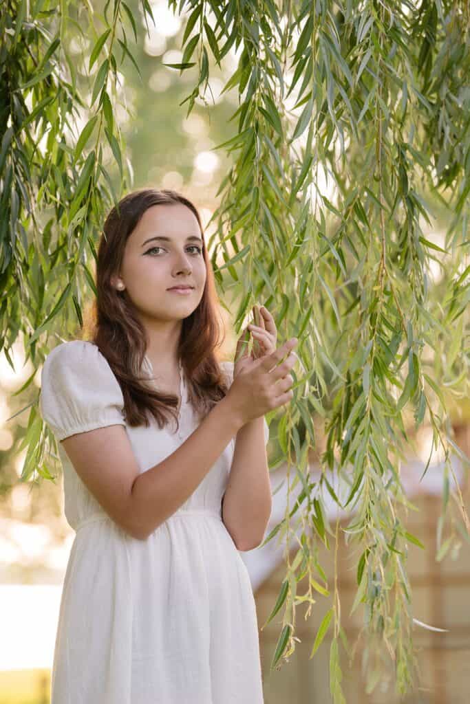 Girl in the willows at Fresh Pickens Farm near Marietta OH for her Senior Photography Session