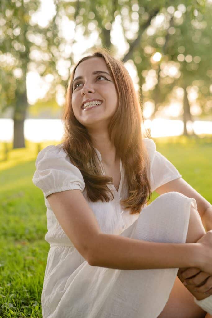 Girl smiling with sun behind her.  Senior Photography Session in Marietta, OH