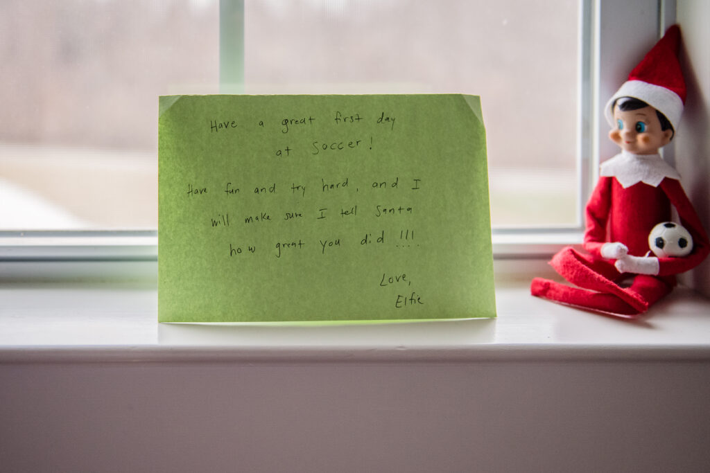 Elf on the Shelf with soccer ball and note